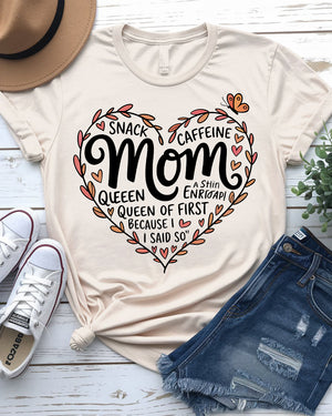 Mom wearing Snack & Caffeine Queen tee