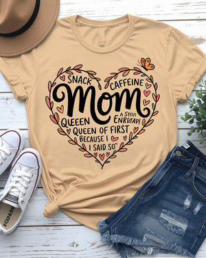 Mom wearing Snack & Caffeine Queen tee