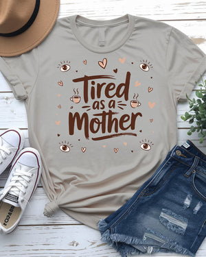 Close-up of bold typographic design: “Tired as Mother”