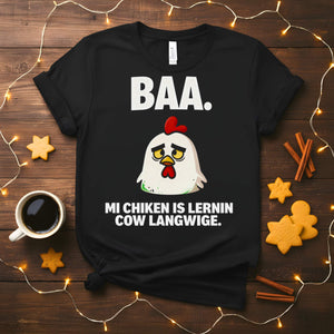 “My Chicken Is Learning Language Meme Funny Tee featuring a talking chicken wearing glasses and holding a book — funny unisex meme shirt.”