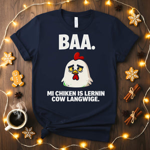 “My Chicken Is Learning Language Meme Funny Tee featuring a talking chicken wearing glasses and holding a book — funny unisex meme shirt.”