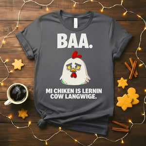 “My Chicken Is Learning Language Meme Funny Tee featuring a talking chicken wearing glasses and holding a book — funny unisex meme shirt.”