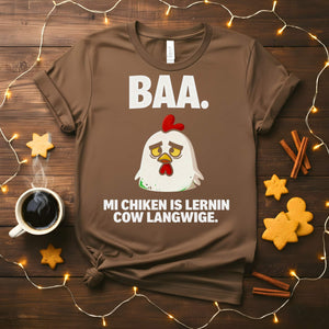 “My Chicken Is Learning Language Meme Funny Tee featuring a talking chicken wearing glasses and holding a book — funny unisex meme shirt.”