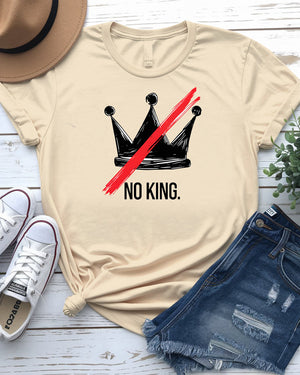 “No King” political meme t-shirt in black with white bold text, displayed on unisex model in urban setting – Memez Store