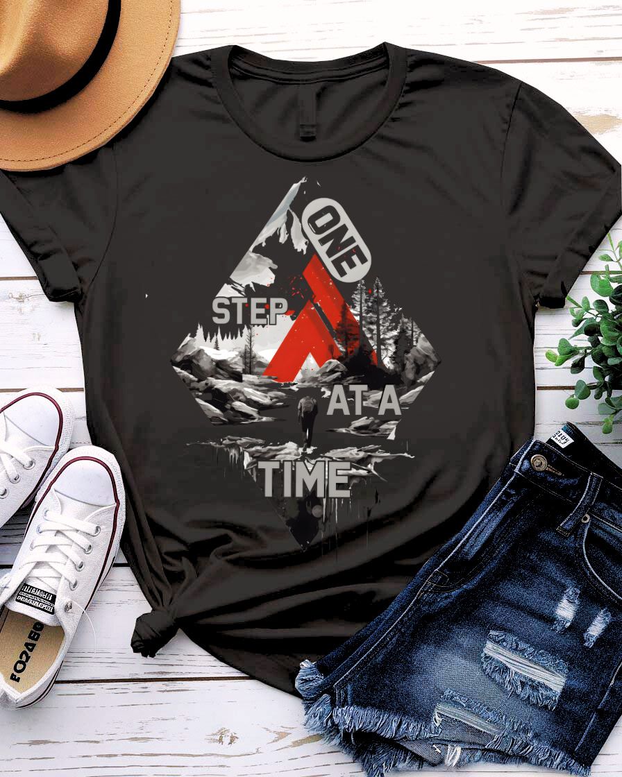 One Step at a Time Adventure Tee with boot prints up mountain on model