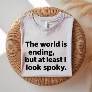 Person wearing a black spooky season tee with ironic doom humor