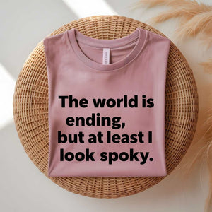 Person wearing a black spooky season tee with ironic doom humor