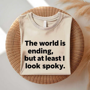 Person wearing a black spooky season tee with ironic doom humor