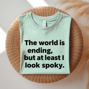 Person wearing a black spooky season tee with ironic doom humor