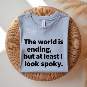 Person wearing a black spooky season tee with ironic doom humor