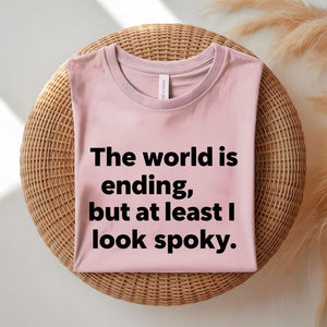 Person wearing a black spooky season tee with ironic doom humor