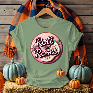 Roti and Roses Tee with chai cup and rose petals on rustic wood table