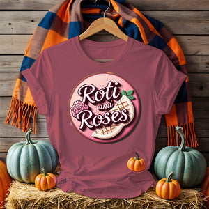 Roti and Roses Tee with chai cup and rose petals on rustic wood table