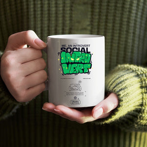 Introvert meme coffee mug close-up on desk