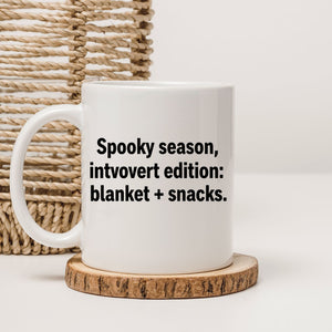 Spooky season funny introvert meme mug on desk
