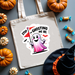 Stop Ghosting Me IRL Halloween cotton tote bag by Memez Store – black text on natural canvas bag with ghost meme design