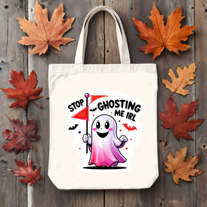 Stop Ghosting Me IRL Halloween cotton tote bag by Memez Store – black text on natural canvas bag with ghost meme design