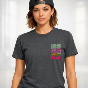 Take Your Dog To Work typographic tee with paw prints on design on model