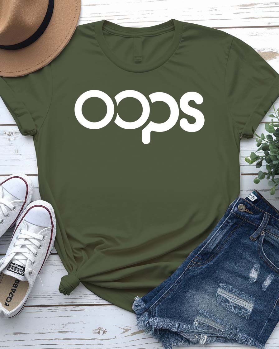 Unisex model wearing a white “Oops” typographical meme tee, styled casually with jeans, laughing and looking off-camera