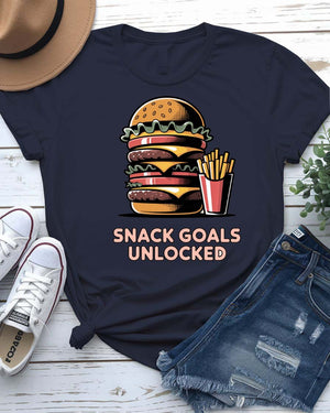 Unisex t-shirt with “Snack Goals Unlocked” text in gamer-style design by Memez Store