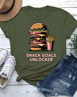 Unisex t-shirt with “Snack Goals Unlocked” text in gamer-style design by Memez Store