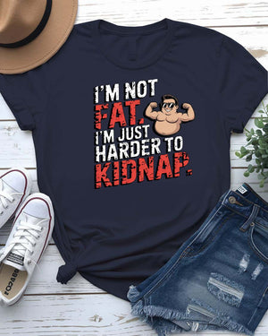 Unisex t-shirt with bold black typography that reads “I Am Not Fat I Am Just Harder to Kidnap” – meme fashion with a body-positive punchline.