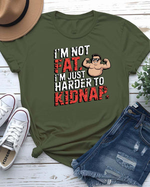 Unisex t-shirt with bold black typography that reads “I Am Not Fat I Am Just Harder to Kidnap” – meme fashion with a body-positive punchline.