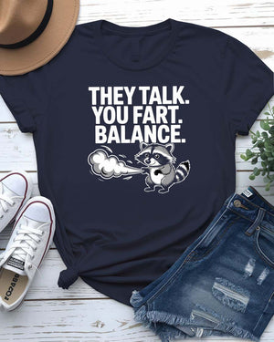 Unisex tee with the bold phrase “They Talked You Fart” in playful, modern type – a perfect shirt for awkward humor lovers.