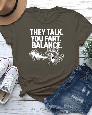 Unisex tee with the bold phrase “They Talked You Fart” in playful, modern type – a perfect shirt for awkward humor lovers.