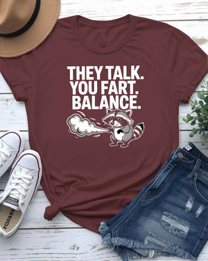 Unisex tee with the bold phrase “They Talked You Fart” in playful, modern type – a perfect shirt for awkward humor lovers.