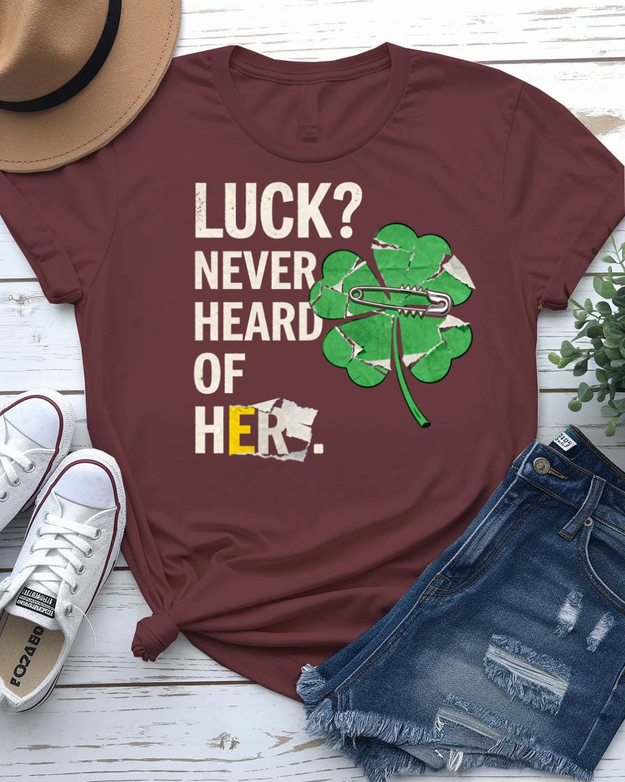 Luck Never Heard of Her St. Patrick's Tee with confident woman walking past clovers on model