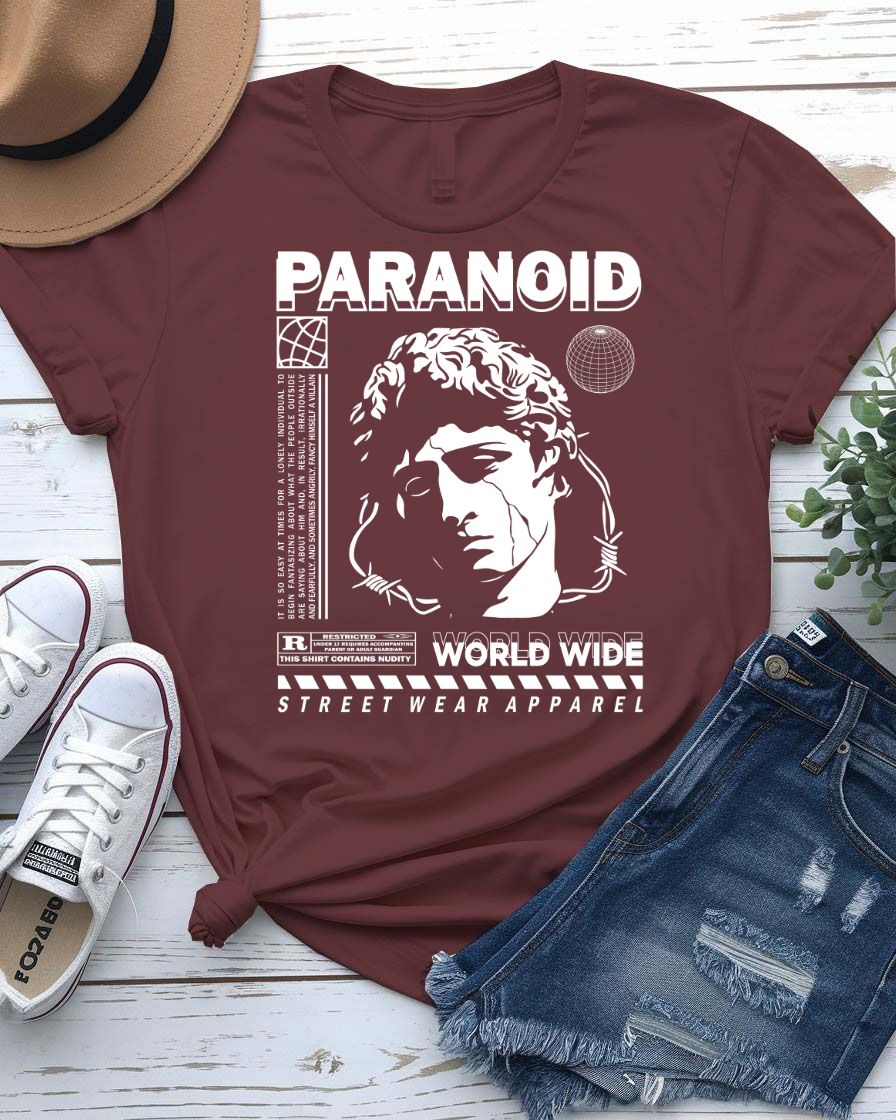 Paranoid Streetwear Tee with all-seeing eye behind chain link fence on model
