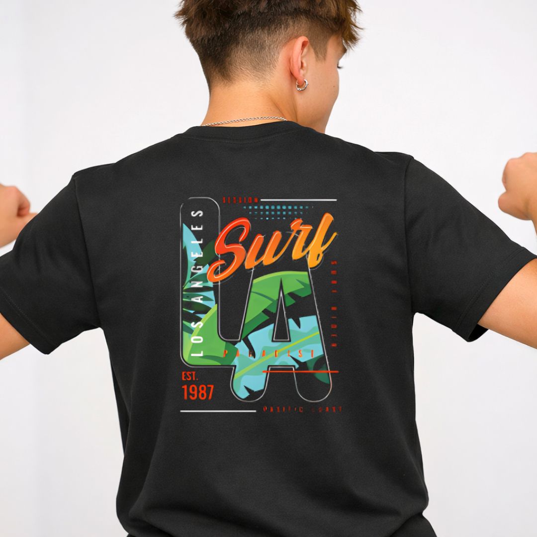 LA Surf Streetwear Tee with surfboard at sunset on model