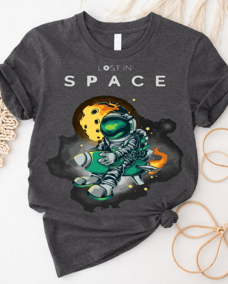 Space graphic t-shirt with astronaut floating through galaxy design front view