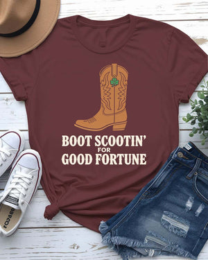 Boot Scootin' St. Patrick's Day Tee with dancing boots and shamrock trails on model