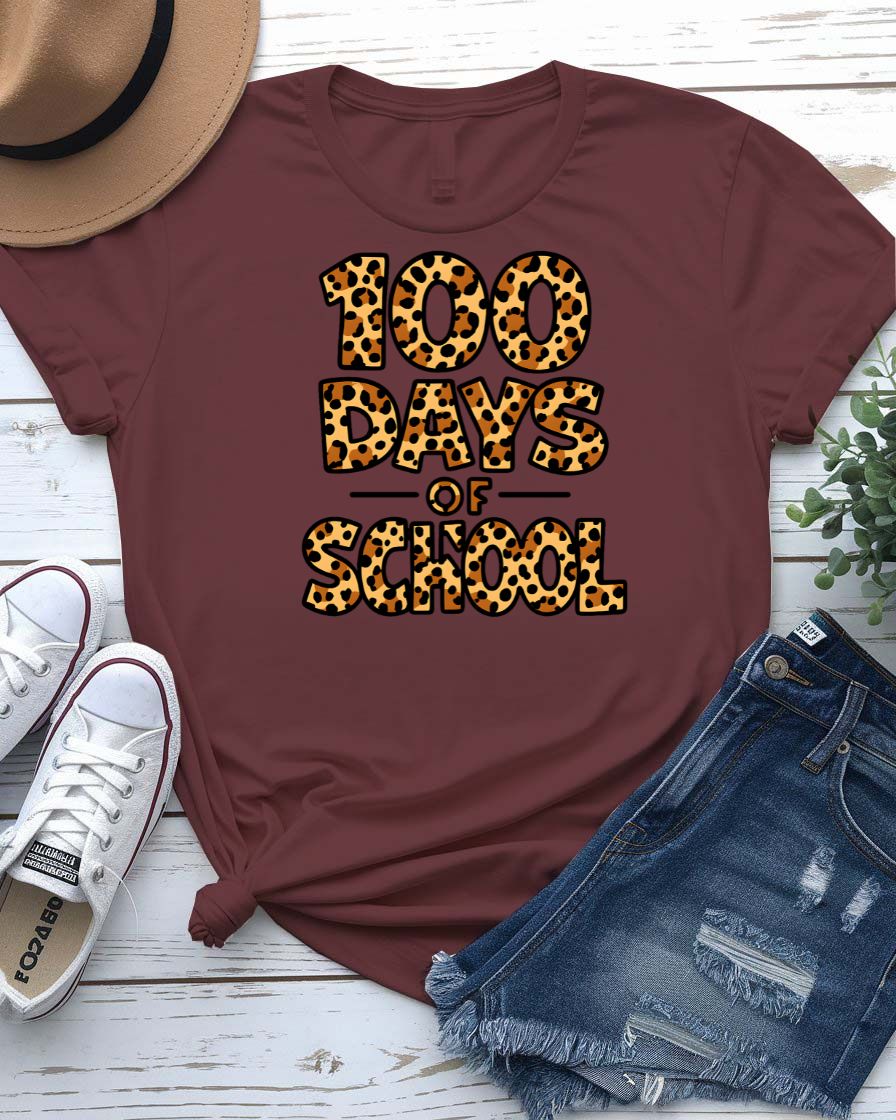 Kids 100 Days of School t-shirt in green camo with bright orange text