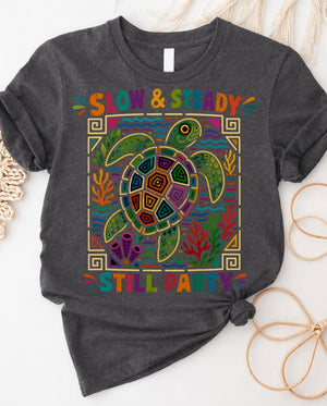Slow and steady t-shirt with determined turtle crossing finish line design