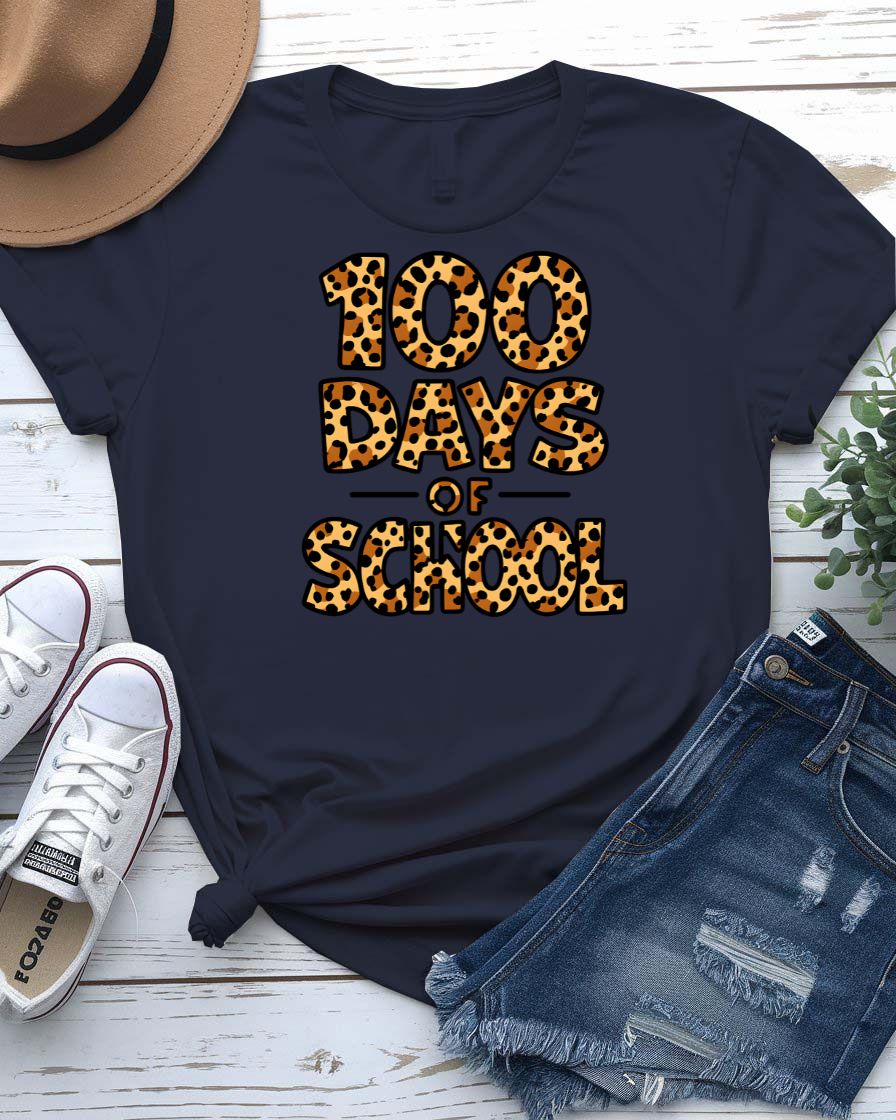 Kids 100 Days of School t-shirt in green camo with bright orange text