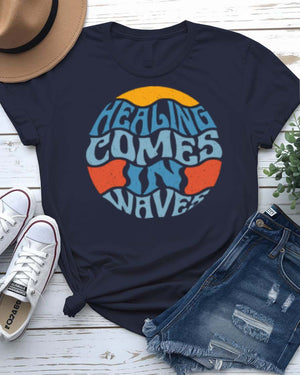 Healing Comes in Waves Tee with gentle ocean waves on model