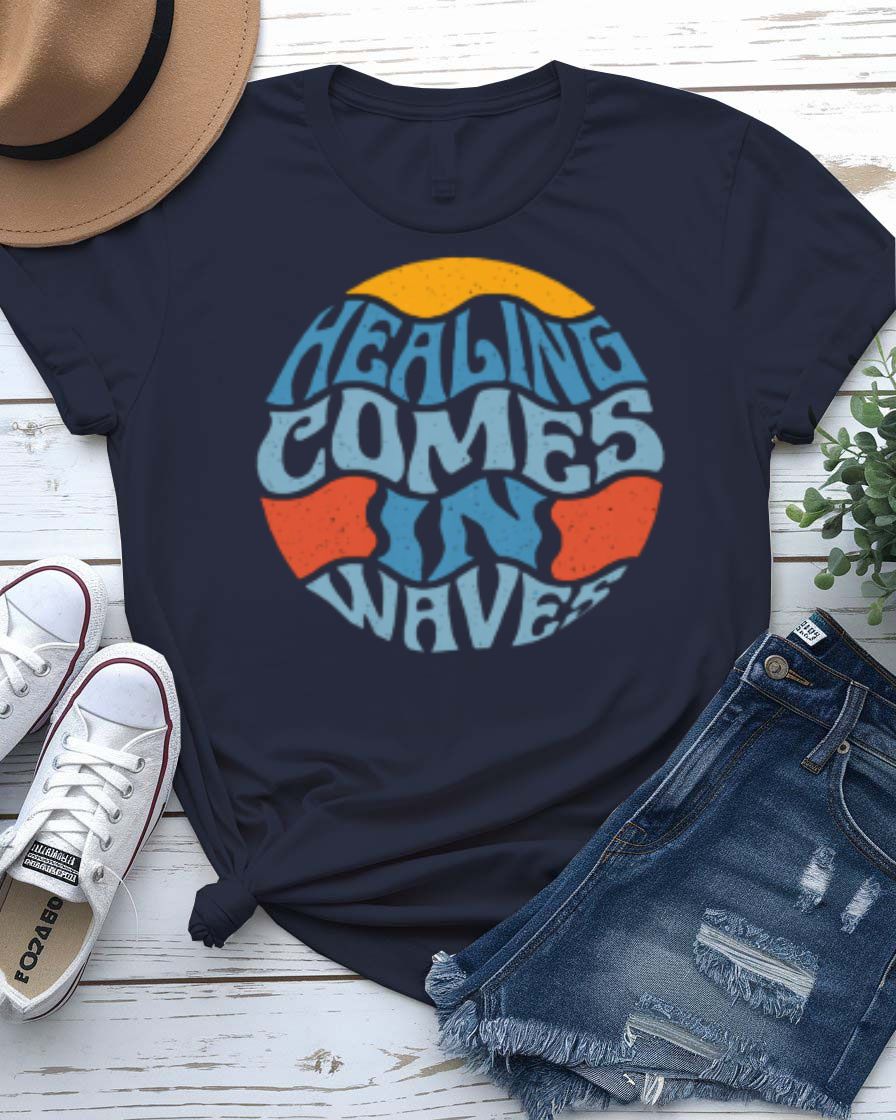 Healing Comes in Waves Tee with gentle ocean waves on model