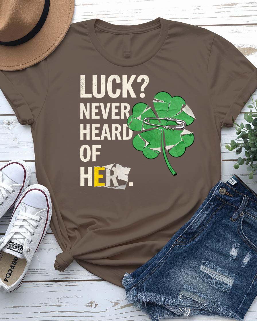 Luck Never Heard of Her St. Patrick's Tee with confident woman walking past clovers on model