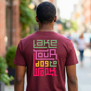 Take Your Dog To Work typographic tee with paw prints on design on model