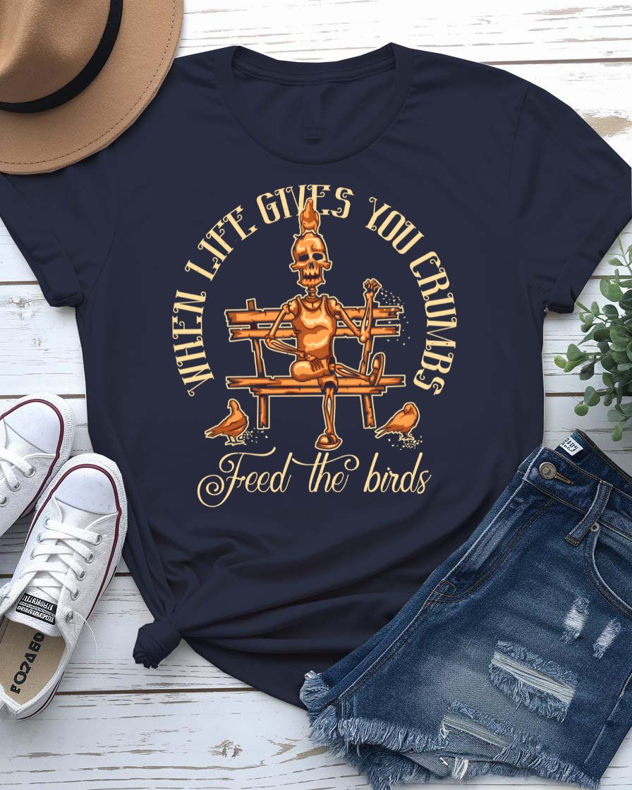 Feed The Bird T-Shirt with hand offering seeds to sparrow on model