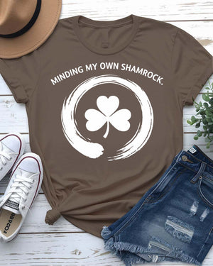 Minding My Own Shamrock St. Patrick's Day Tee with peaceful shamrock on model
