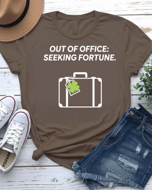 Out of Office Seeking Fortune St. Patrick's Day Tee with shamrock laptop on model