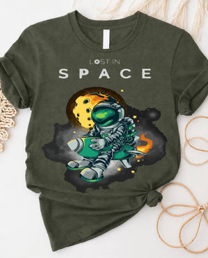 Space graphic t-shirt with astronaut floating through galaxy design front view