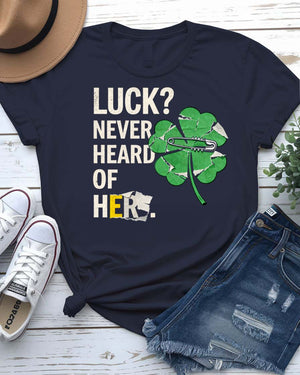 Luck Never Heard of Her St. Patrick's Tee with confident woman walking past clovers on model