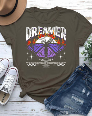 Dreamer Streetwear T-Shirt with silhouette and paper airplane graphic on model