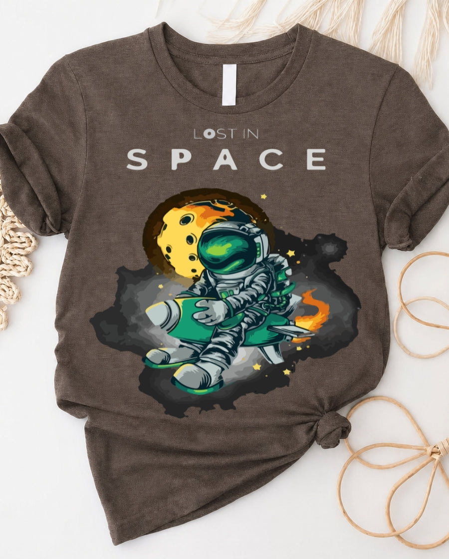 Space graphic t-shirt with astronaut floating through galaxy design front view