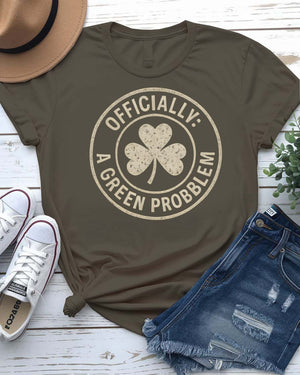 Officially A Green Problem St. Patrick's Tee with warning label design on model